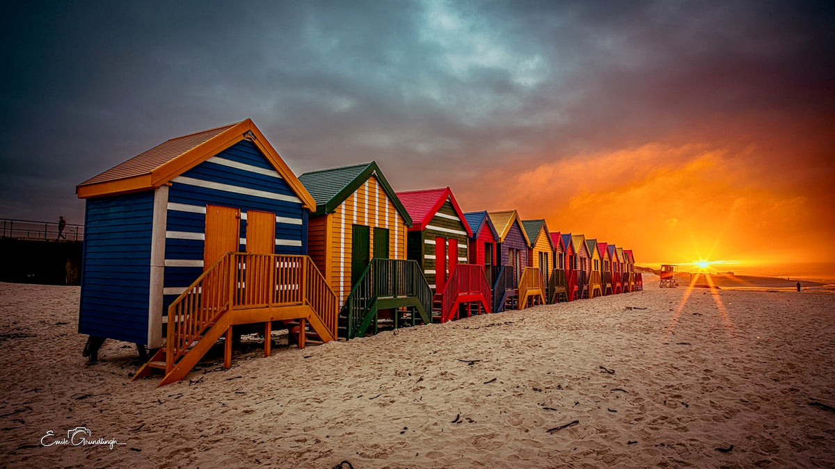Colourful Muizenberg beach huts at sunset by Emile Grundlingh