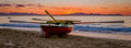 A Ragnaar rowing boat on the beach at sunset, False Bay