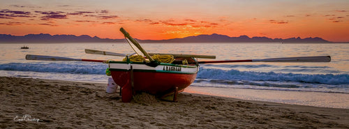 A Ragnaar rowing boat on the beach at sunset, False Bay