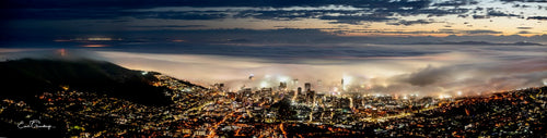 Cape Town CBD emerging through thick mist at night panorama