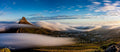 Lion's Head rising above a river of clouds cascading over Cape Town