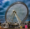 Cape Wheel at V&A Waterfront captured as a blur of spinning motion in a long exposure photograph