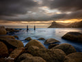 Sentinel at golden hour over Hout Bay with long exposure water and granite boulders by Emile Grundlingh