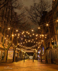 St George's Mall at night with starburst fairy lights canopying the deserted pedestrian street in Cape Town CBD