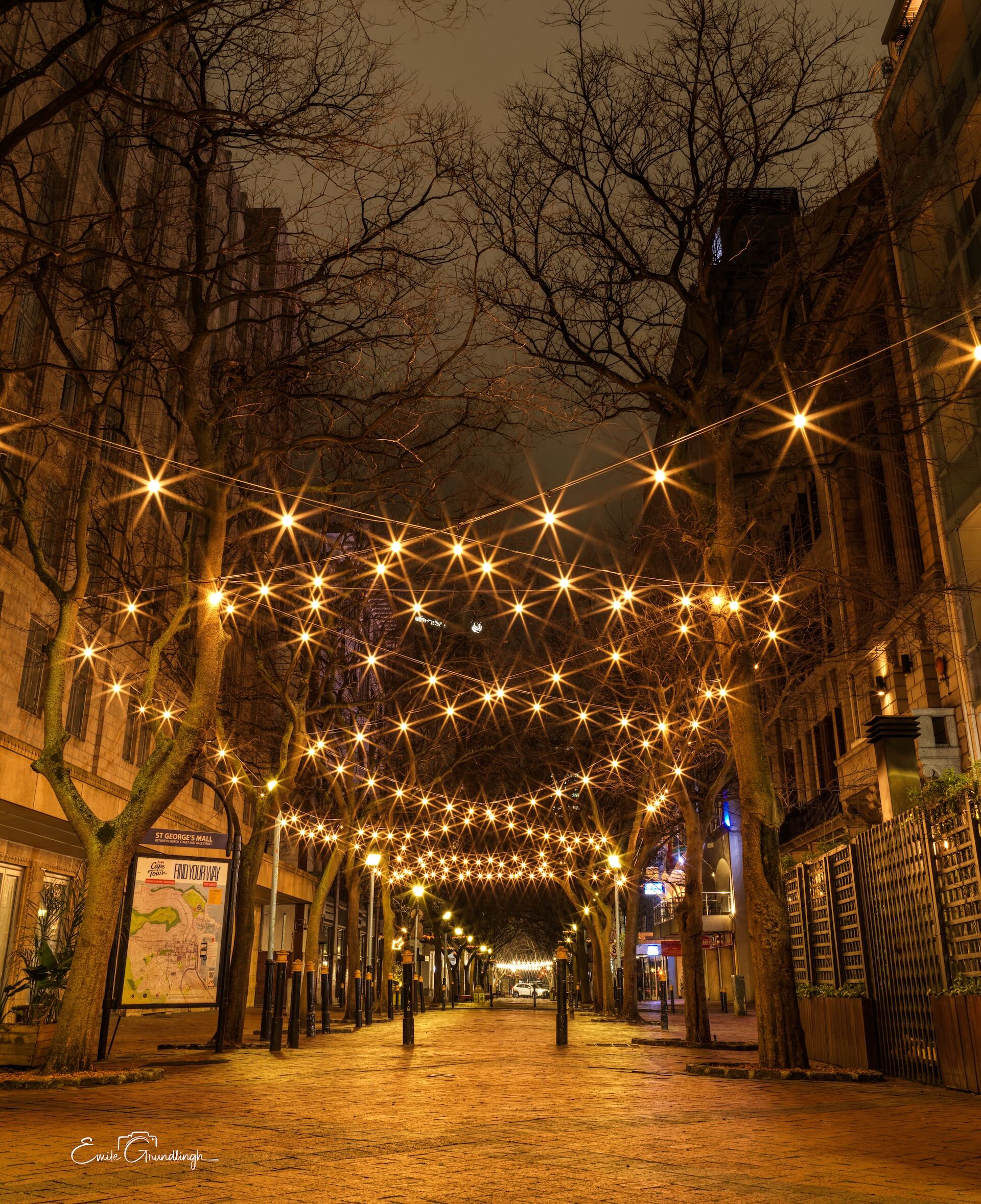 St George's Mall at night with starburst fairy lights canopying the deserted pedestrian street in Cape Town CBD