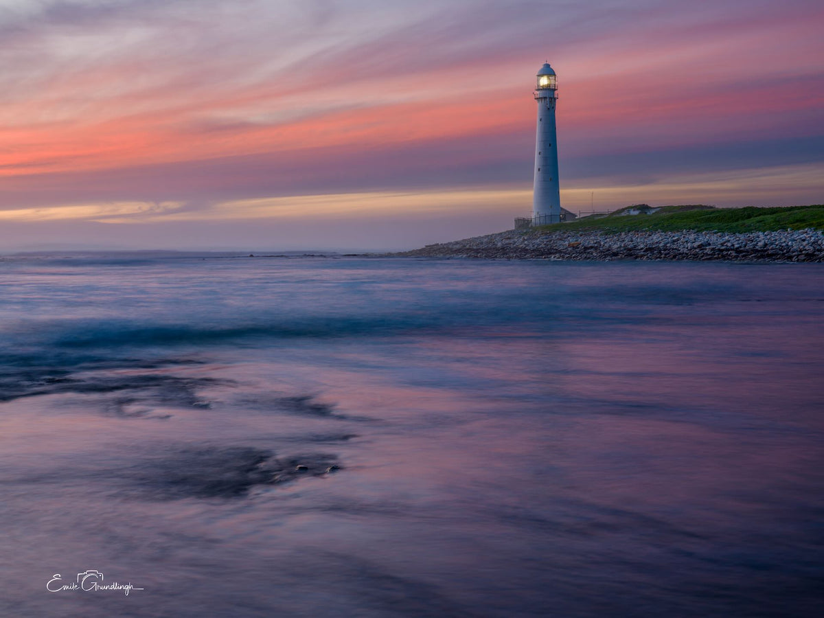Pink Skies Over Kommetjie – Slangkop Lighthouse at sunset with pastel sky reflection