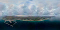 Aerial panorama of the Deep South peninsula showing Simon's Town marina, Boulders Beach and mountain range under dramatic clouds over False Bay
