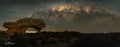 The Sewing Machine rock formation in the Karoo beneath a golden Milky Way arch, photographed by Emile Grundlingh.