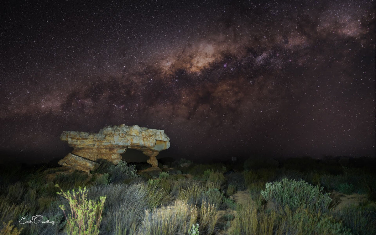 The Sewing Machine sandstone rock formation under the Milky Way at Kagga Kamma, Cederberg