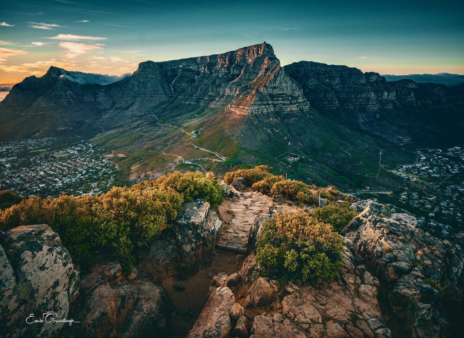 Table Mountain from Lion's Head summit at golden hour with Cape Town below