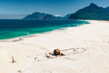 Aerial view of the SS Kakapo shipwreck on Noordhoek Long Beach with Hout Bay mountains by Emile Grundlingh