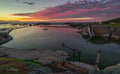 Daybreak at Millers Point tidal pool under a pink and red sky